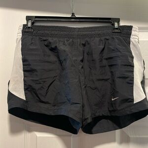 Black and white Nike running shorts.